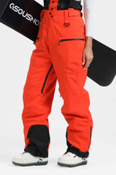 Pantalones de nieve holgados con aislamiento en rojo neón para mujer con tirantes desmontables